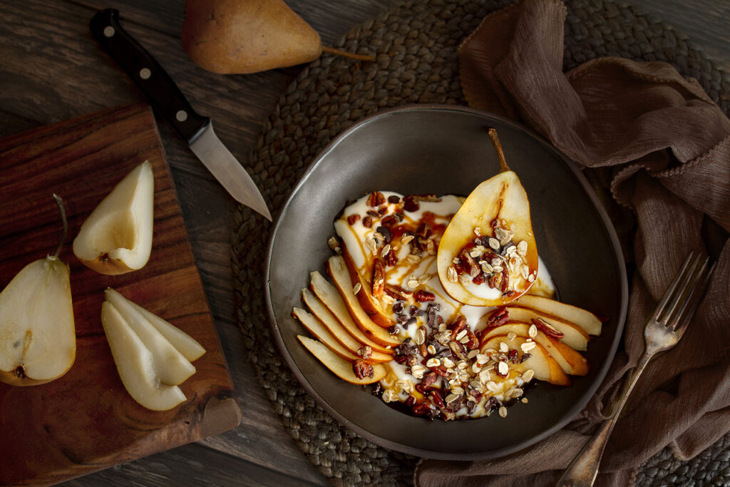 Vegan breakfast bowl with yogurt and pears